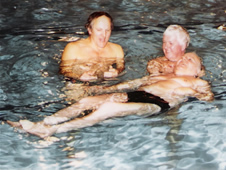 People recieving tuition in the swimming pool
